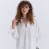 Блуза oversize молочна з рюшами внизу рукавів